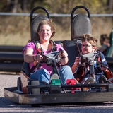 People riding in a go-cart.