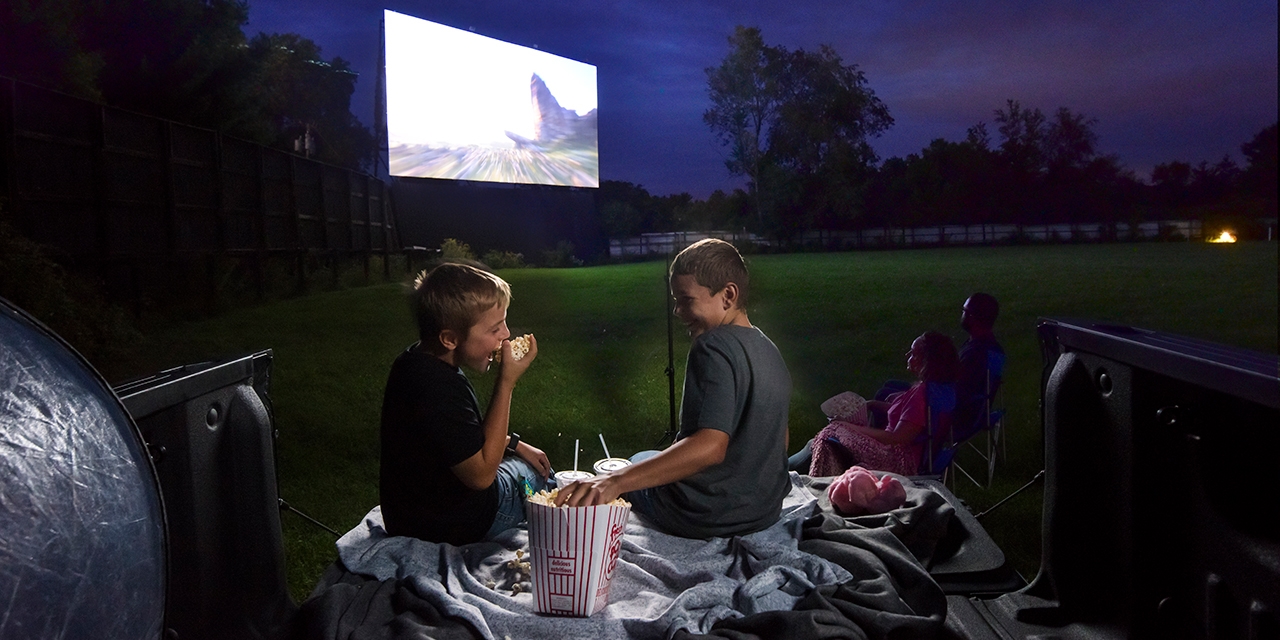 A family watches a movie at the Big Sky Twin Drive-In Theater.