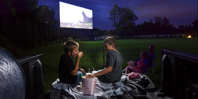 A family watches a movie at the Big Sky Twin Drive-In Theater.