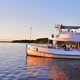 The dinner cruise heads toward the sunset for guests to admire.