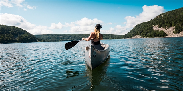 A woman canoes on Devil's Lake.