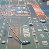 A casino table with dice and poker chips.