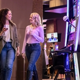 Some women enjoying drinks in the casino.