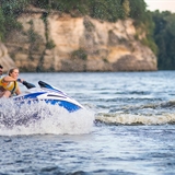 A couple on a jet ski in Wisconsin Dells.