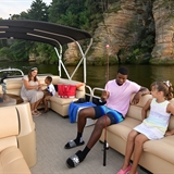 A group of people get ready for fun water activities on a pontoon boat.