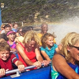 Guests get splashed on a jet boat.