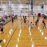 People watch a game of basketball at JustAGame Fieldhouse.