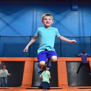 People jumping in the trampoline park.