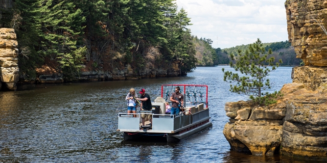 People fishing from a boat in Wisconsin Dells.