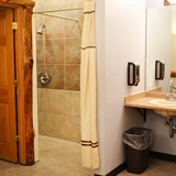 A bathroom with a shower at Spa Del Sol.