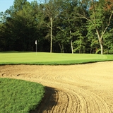 A sand trap in front of the green at Spring Brook Golf Course.