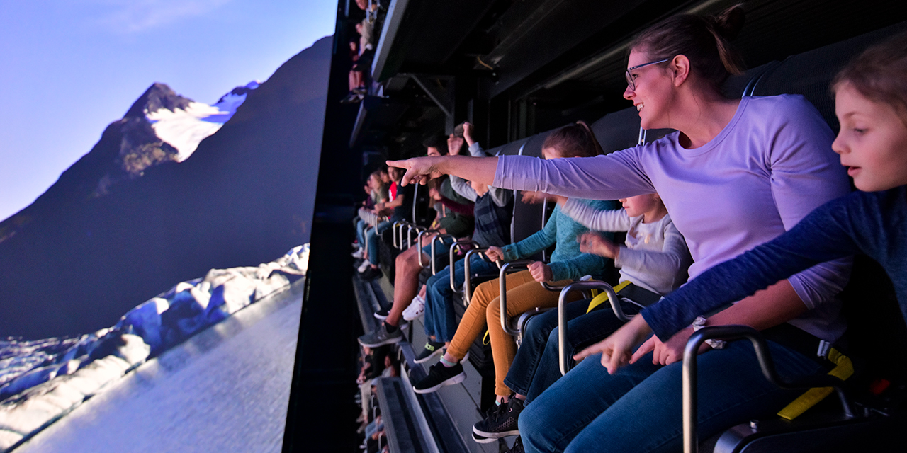 A family enjoys the view at Take Flight Wilderness Aerial Adventure Ride.
