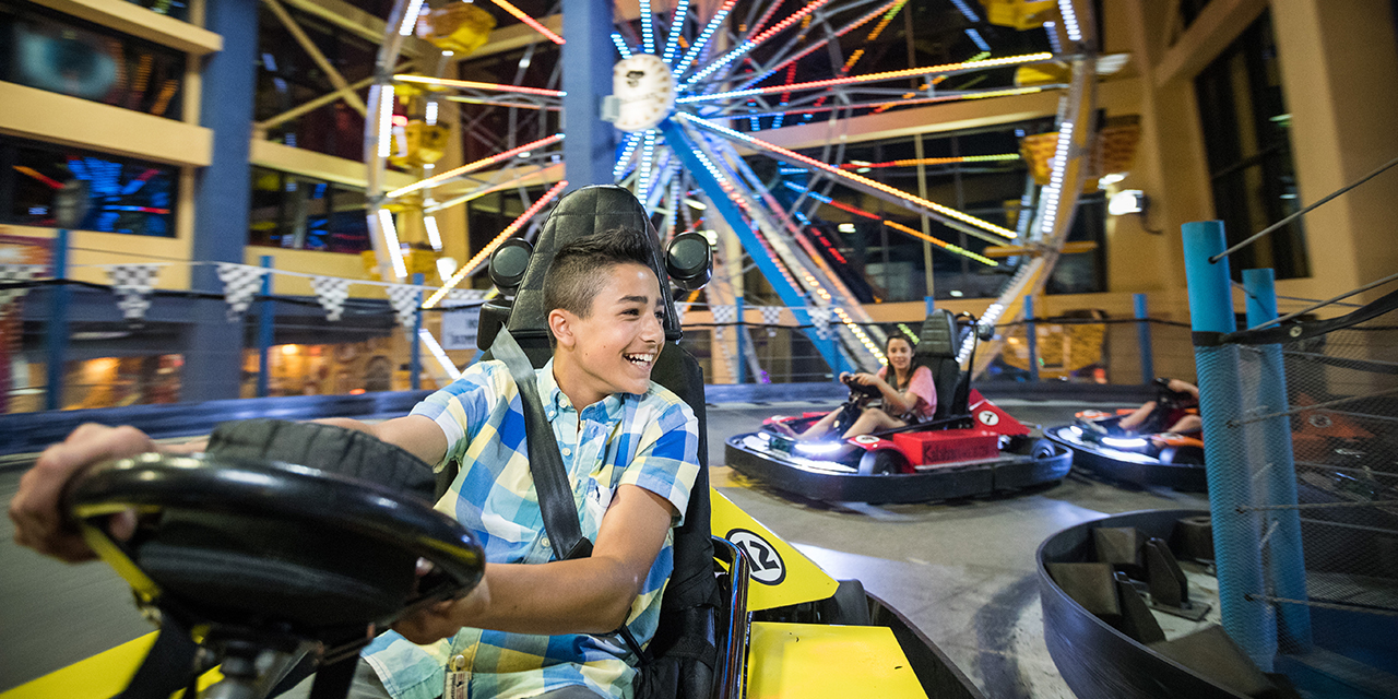 Boy driving go-kart at Tom Foolerys Adventure Park.