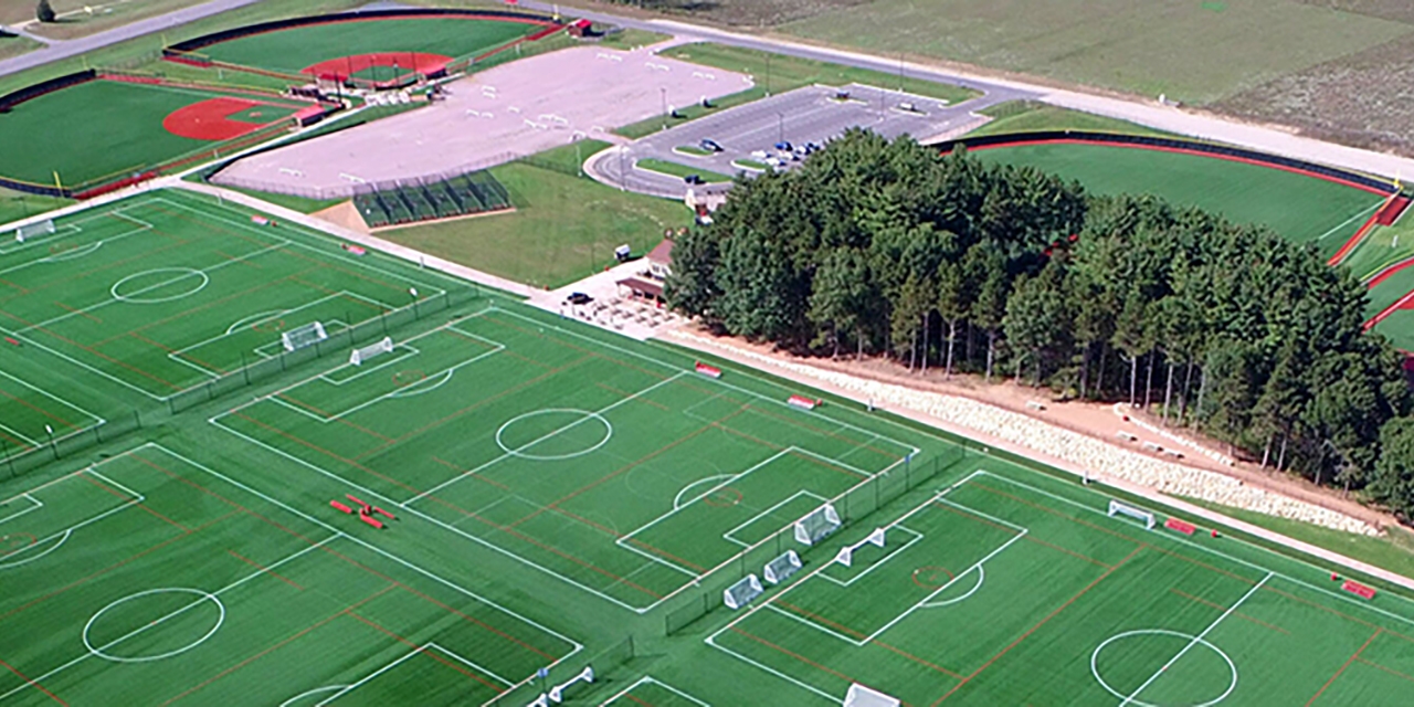 A large sports complex with multiple soccer fields and baseball diamonds.