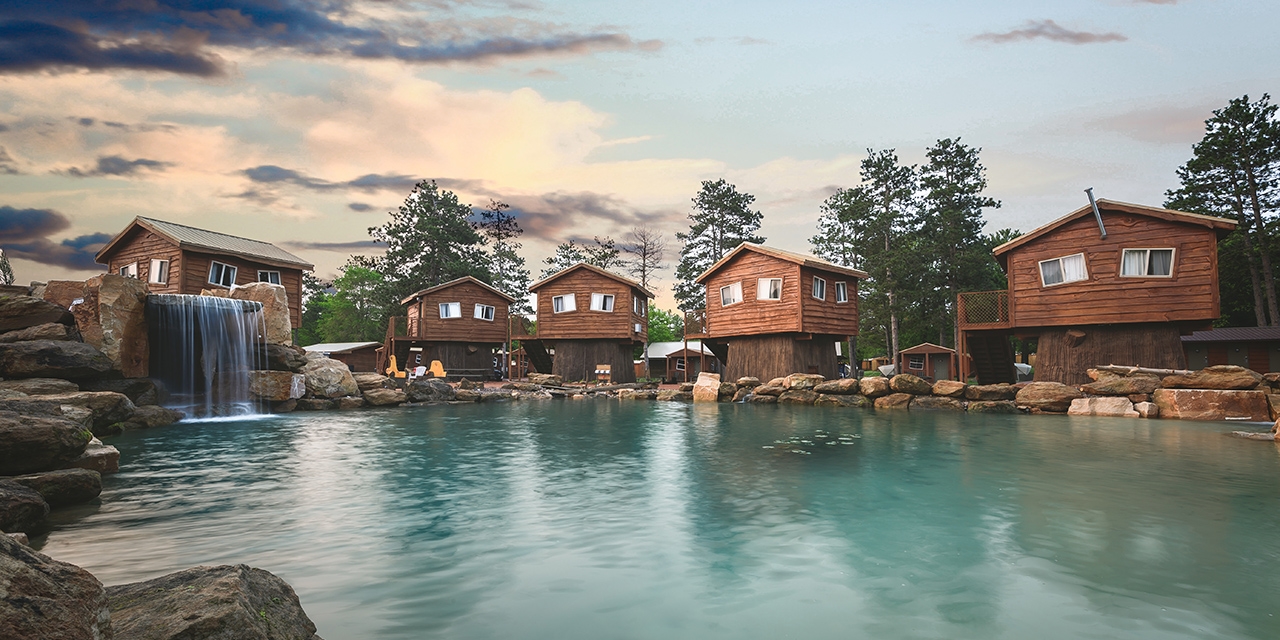 Natura Treescape Resort lodges near the lagoon swimming area.