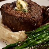 Plated filet mignon with mashed potatoes.