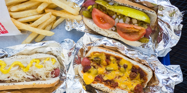 A variety of hot dogs and fries from Hot Dog Avenue.