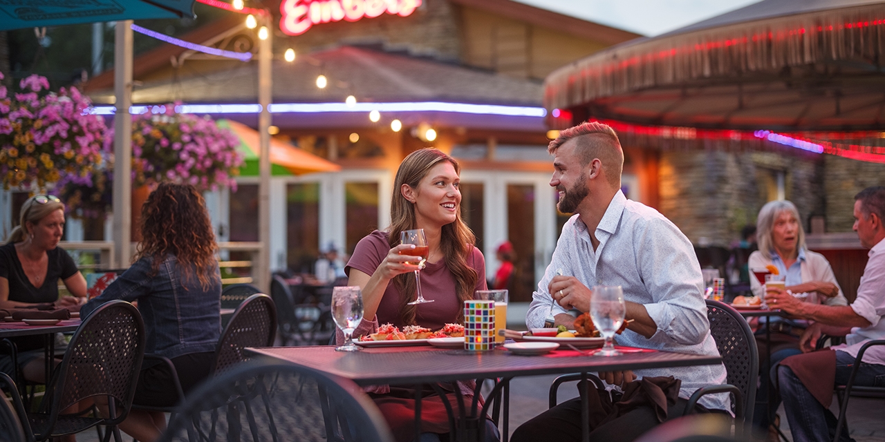 People dine outdoors at House of Embers.