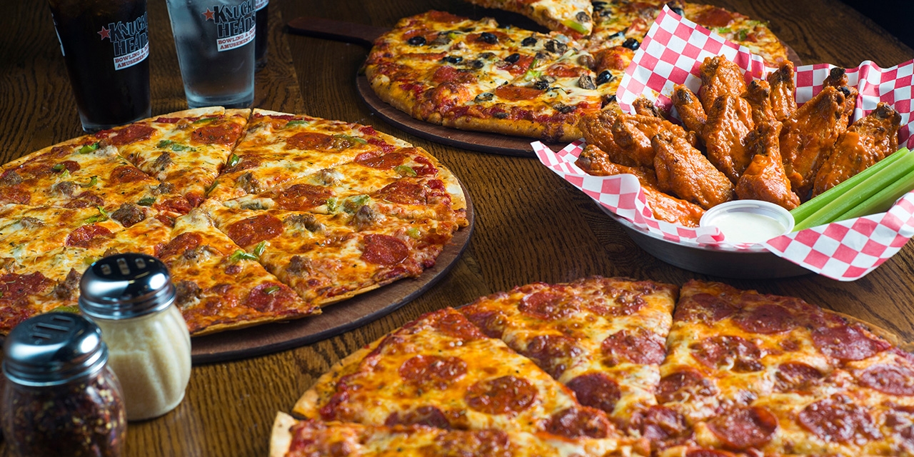Pizzas and chicken wings.