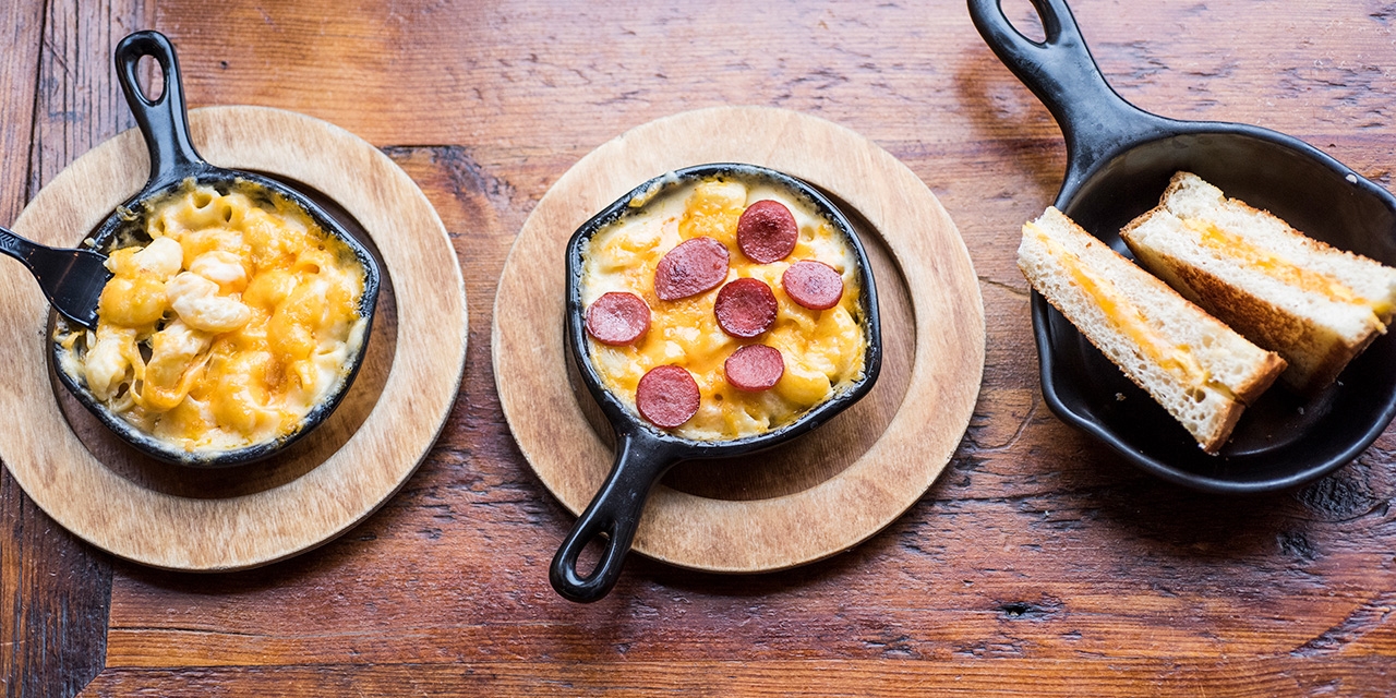 Macaroni and cheese skillets and a grilled cheese.