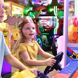 Kids play at the indoor arcade area at Moosejaw Pizza & Dells Brewing Co.
