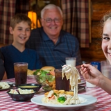 A family enjoying a meal at Paul Bunyan&apos;s Northwoods Cook Shanty.