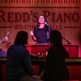 Musicians perform for guests at Redd&apos;s Piano Bar.