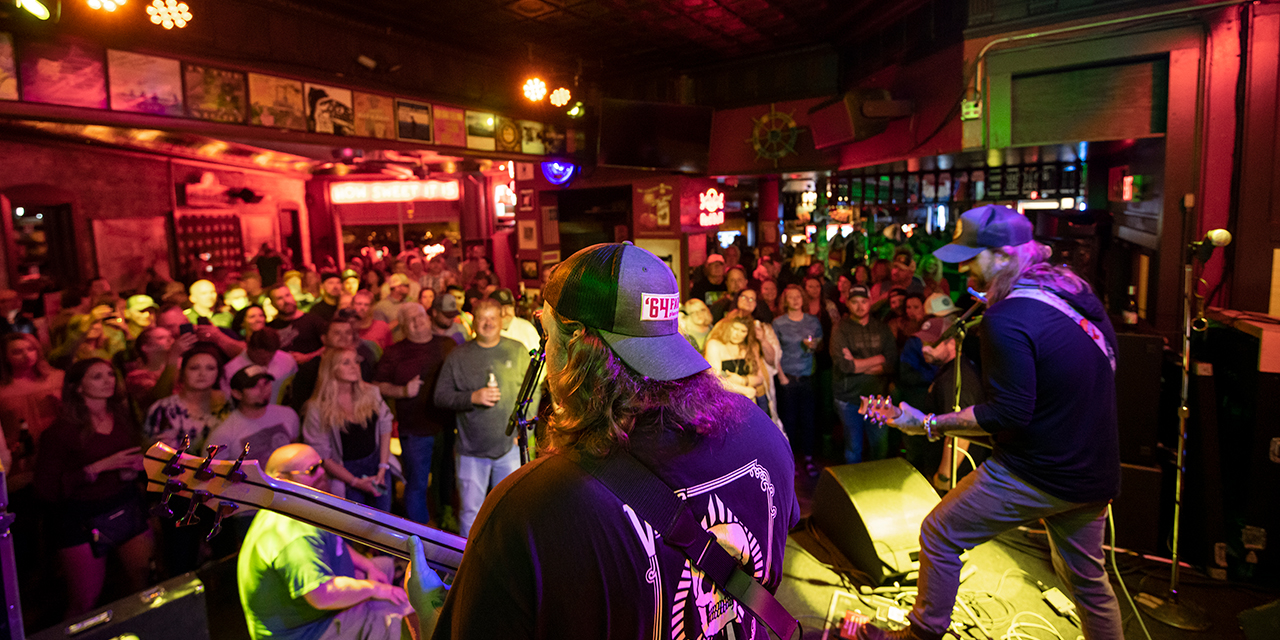 Rock band playing at Showboat Saloon's stage