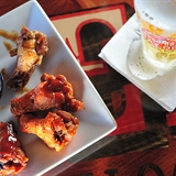 Chicken wings and beer at Showboat Saloon.