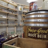 Root beer barrel and root beer glasses.