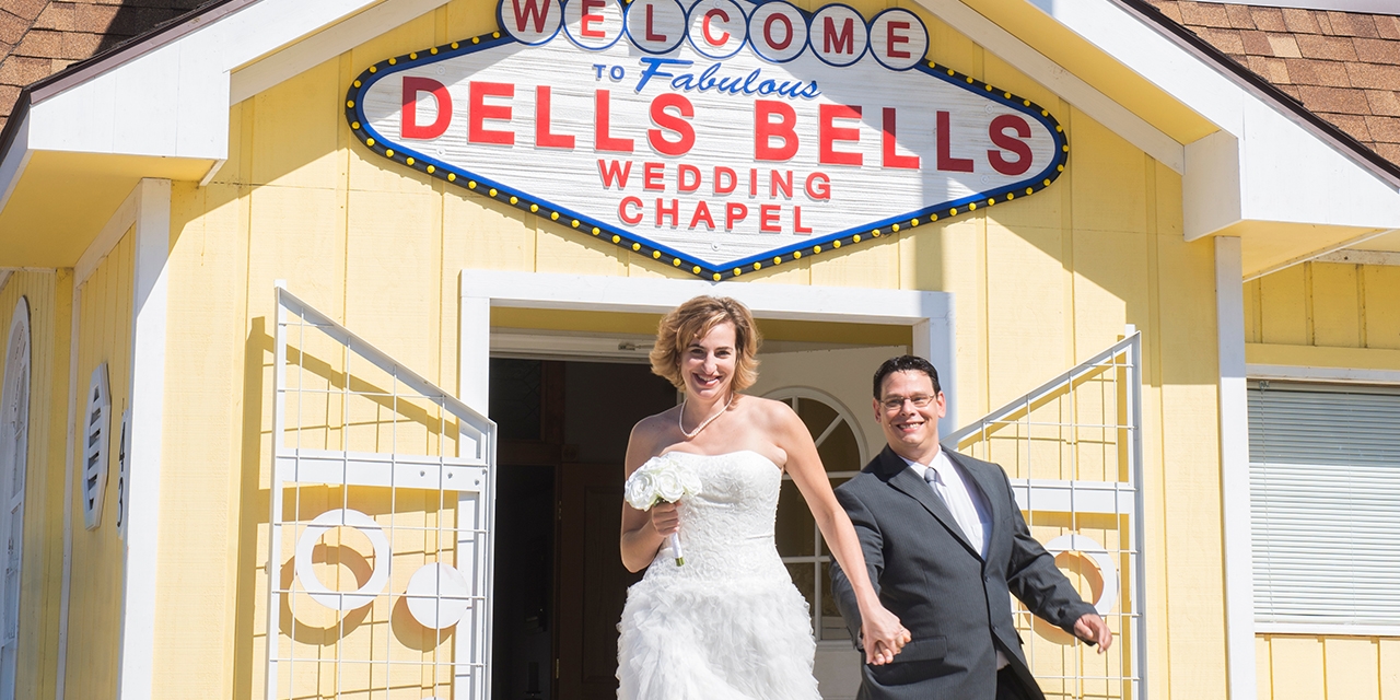 A couple proceeds from the Dells Bells Wedding Chapel.
