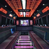 Inside the limo with lights and screens.